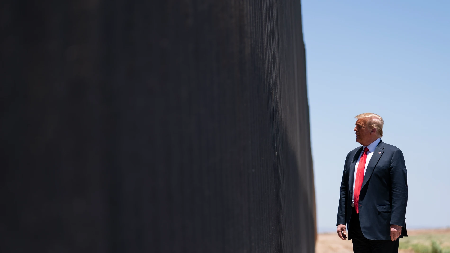 FILE - President Donald Trump tours a section of the border wall in San Luis, Ariz., June 23, 2020. (AP Photo/Evan Vucci, File)