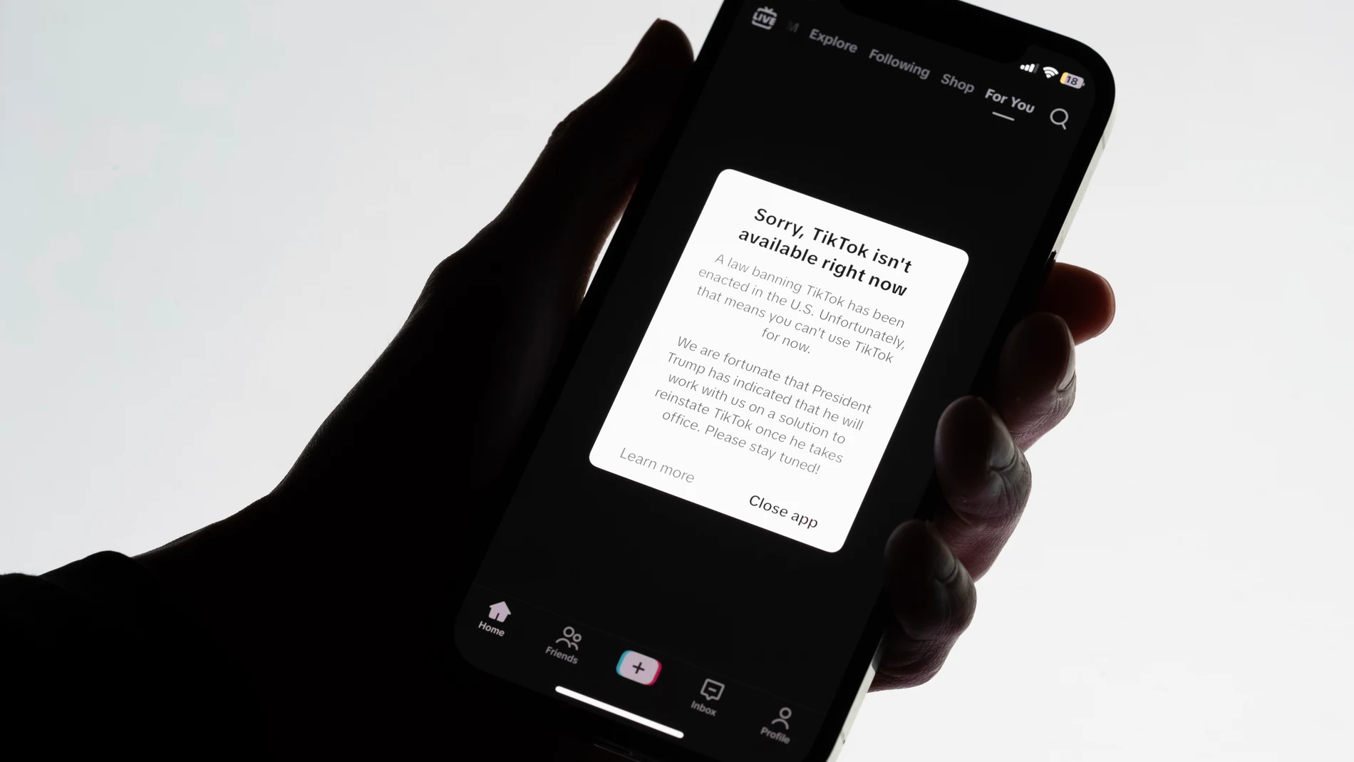 A message reading "Sorry, TikTok isn't available right now" is displayed on a cell phone screen on Saturday, Jan. 18, 2025, in Los Angeles. (AP Photo/Andy Bao)