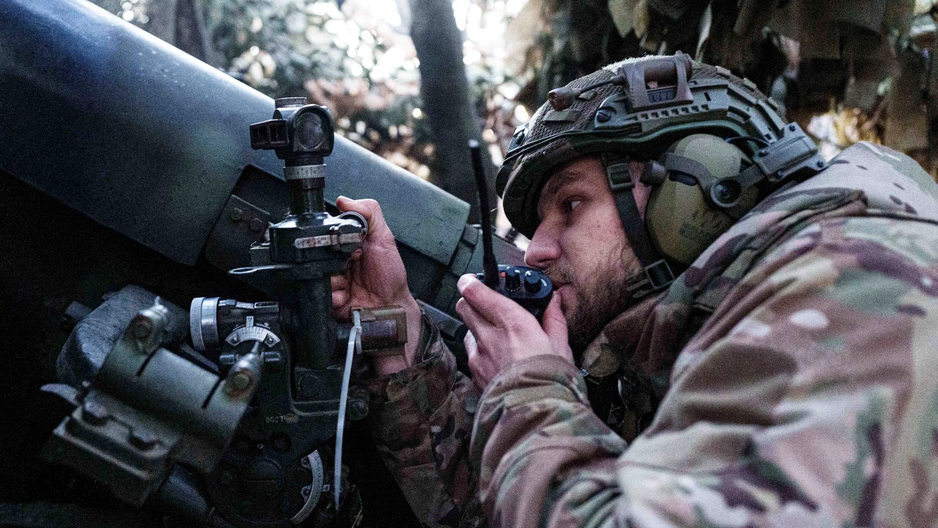 A Ukrainian serviceman of 14th National Guard "Chervona Kalyna" brigade aims his d-20 artillery cannon before firing towards Russian positions at the frontline on Pokrovsk direction, Donetsk region, Ukraine, Monday Jan. 20, 2025. (AP Photo/Evgeniy Maloletka)