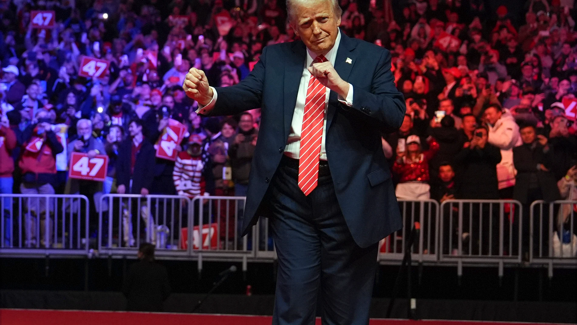 President-elect Donald Trump dances with The Village People at a rally ahead of the 60th Presidential Inauguration, Sunday, Jan. 19, 2025, in Washington. (AP Photo/Evan Vucci)