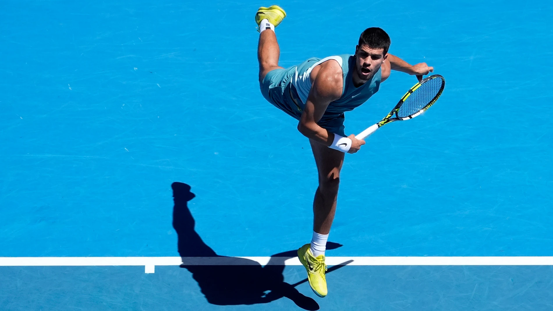 Carlos Alcaraz of Spain serves to Nuno Borges of Portugal during their third round match at the Australian Open tennis championship in Melbourne, Australia, Friday, Jan. 17, 2025. (AP Photo/Asanka Brendon Ratnayake)