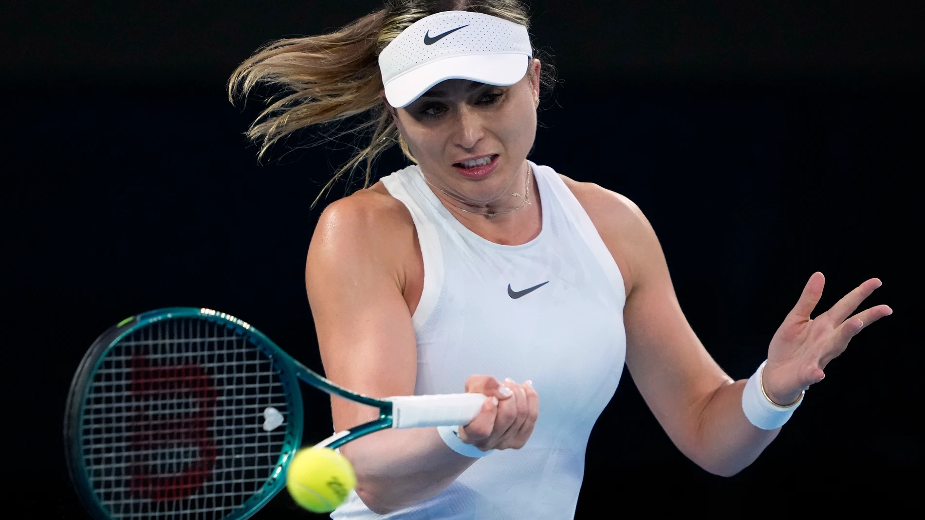 Paula Badosa of Spain plays a forehand return to Aryna Sabalenka of Belarus during their semifinal match at the Australian Open tennis championship in Melbourne, Australia, Thursday, Jan. 23, 2025. (AP Photo/Ng Han Guan)