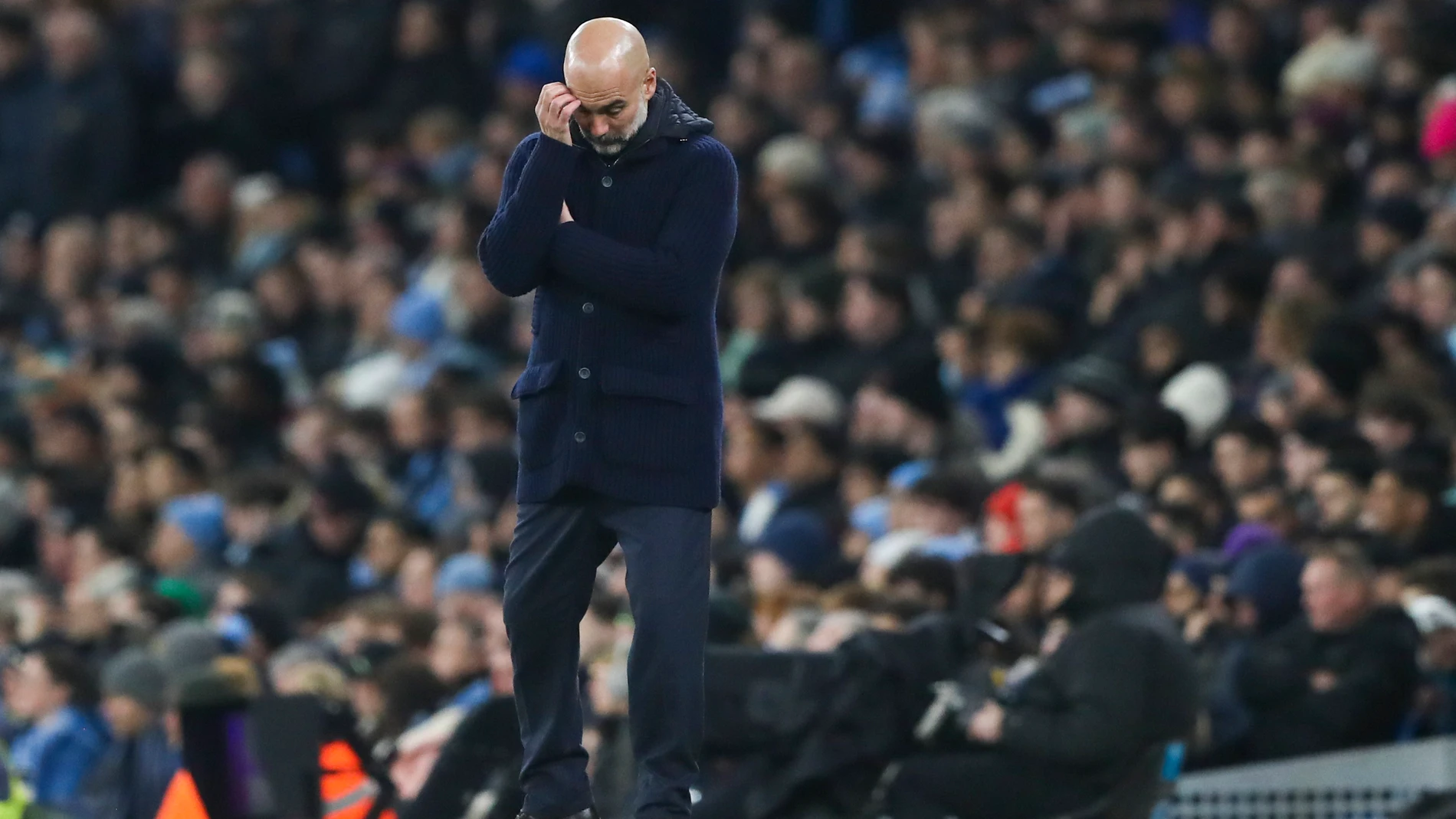 Manchester City's head coach Pep Guardiola reacts during the English Premier League soccer match between Manchester City and Chelsea at Etihad Stadium in Manchester, England, Saturday, Jan. 25, 2025. (AP Photo/Scott Heppell)