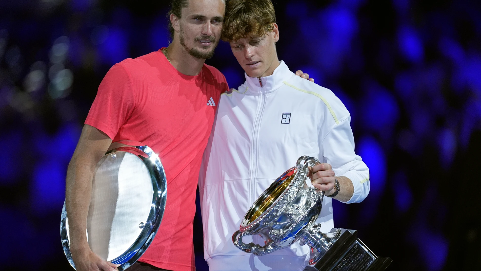 Jannik Sinner, right, of Italy holds the Norman Brookes Challenge Cup after defeating Alexander Zverev of Germany in the men's singles final at the Australian Open tennis championship in Melbourne, Australia, Sunday, Jan. 26, 2025. (AP Photo/Ng Han Guan)