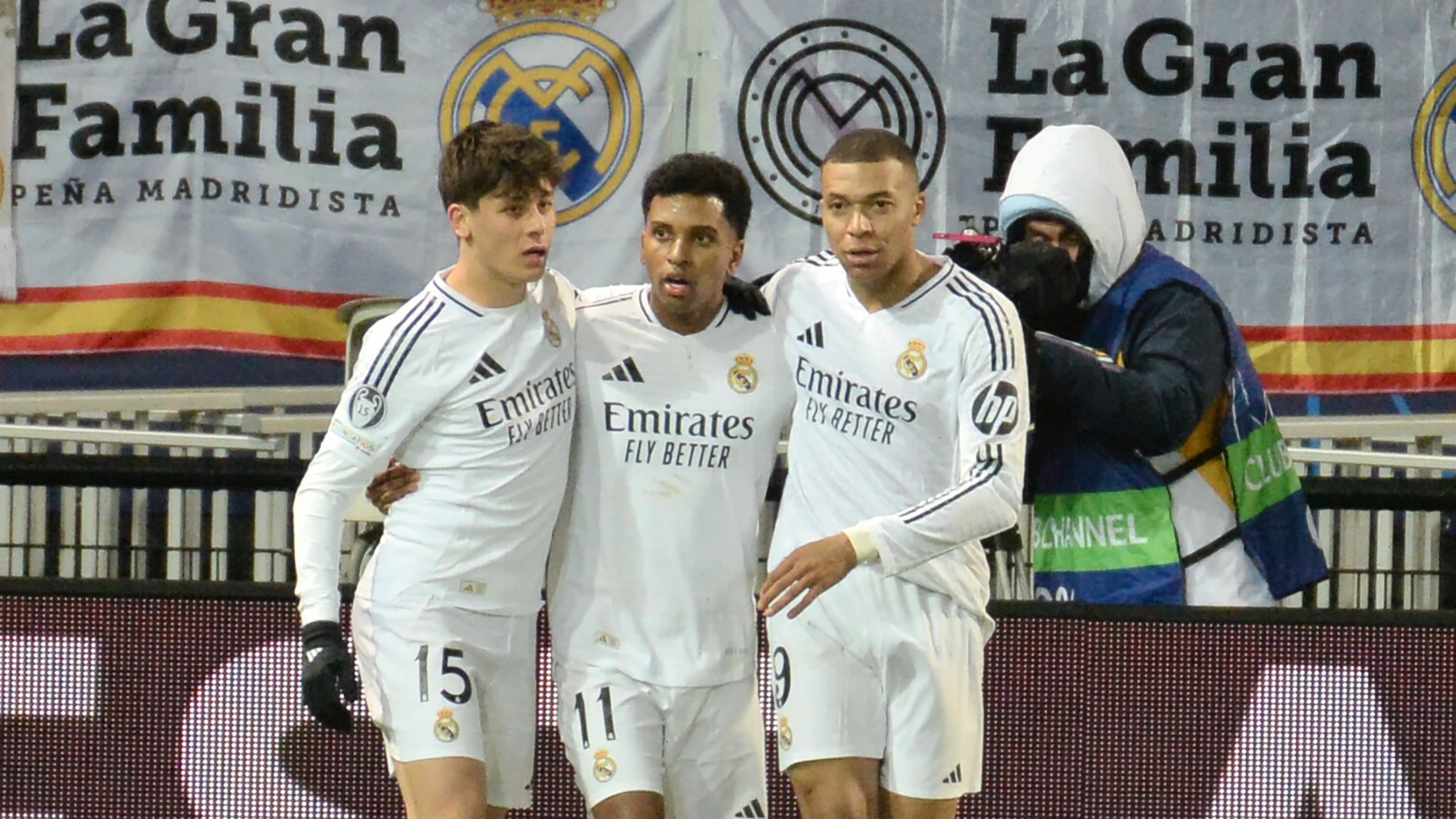 Real Madrid's Rodrygo, centre, celebrates with his teammates Kylian Mbappe, right, and Arda Guler after scoring his side's third goal during the Champions League opening phase soccer match between Brest and Real Madrid at Roudourou stadium in Guingamp, France, Wednesday, Jan. 29, 2025. (AP Photo/Mathieu Pattier)