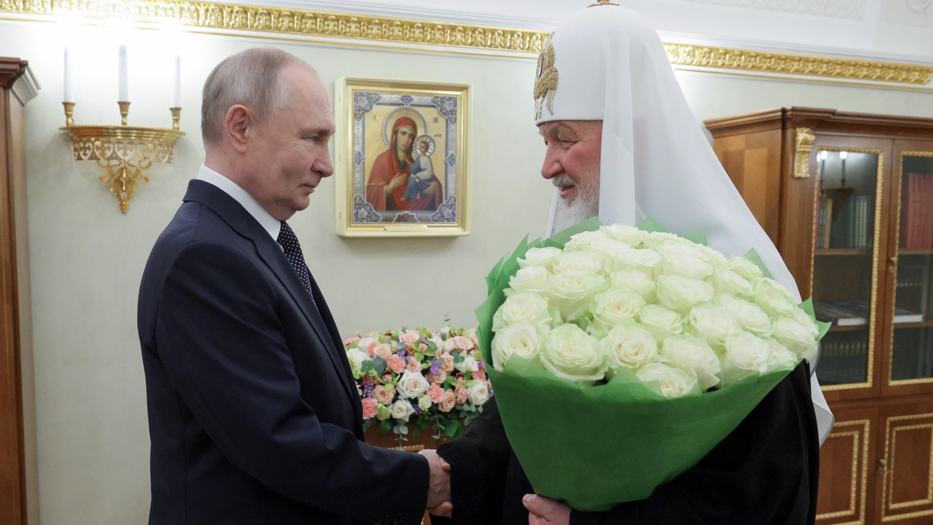 Russian President Vladimir Vladimir, left, congratulates Russian Orthodox Church Patriarch Kirill with the 16th anniversary of his enthronement at the Patriarchal Chambers of the Kremlin in Moscow, Russia, Saturday, Feb. 1, 2025. (Gavriil Grigorov, Sputnik, Kremlin Pool Photo via AP)