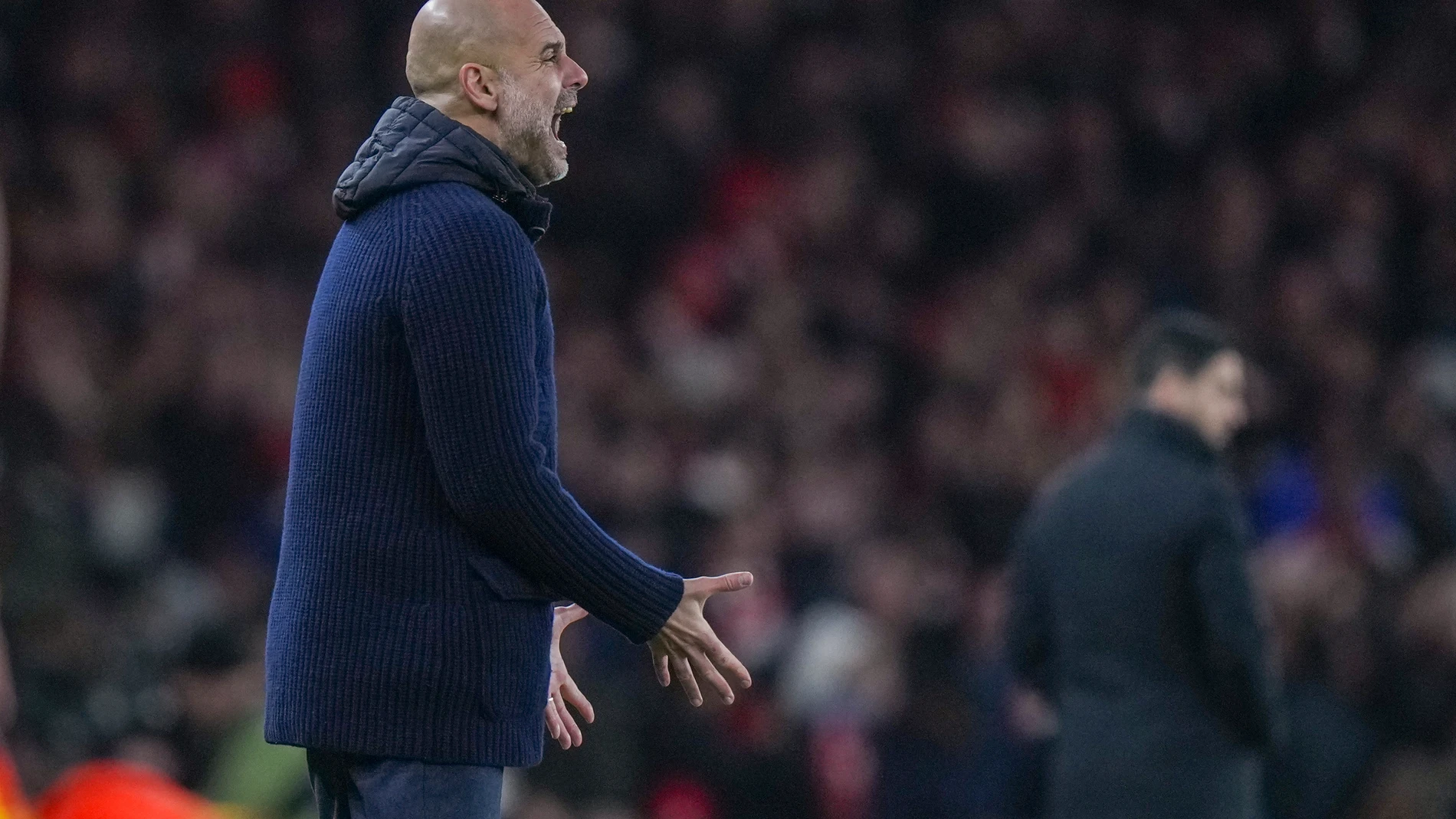 Manchester City's head coach Pep Guardiola reacts during the English Premier League soccer match between Arsenal and Manchester City at the Emirates stadium in London, Sunday, Feb. 2, 2025. (AP Photo/Alastair Grant)