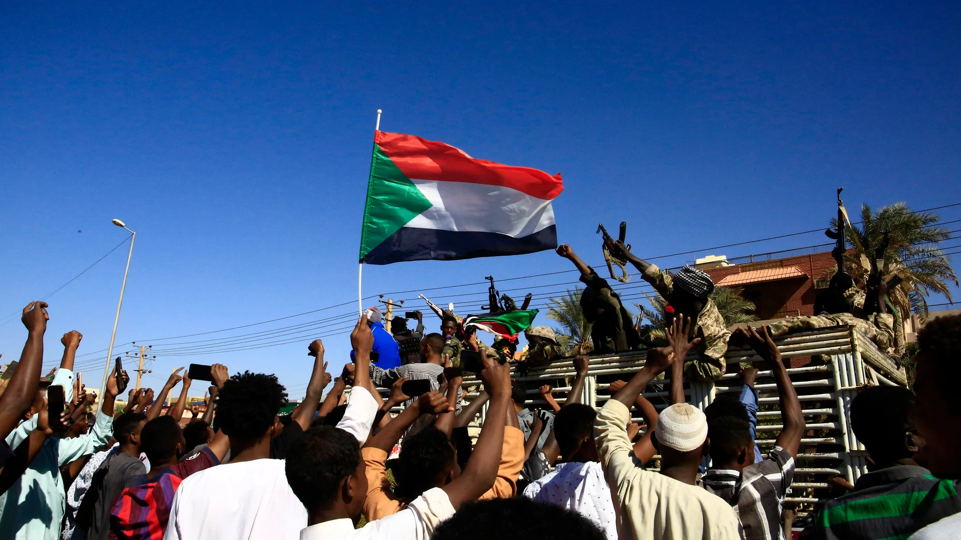 OMDURMAN, Jan. 12, 2025 -- This photo taken on Jan. 11, 2025 shows people celebrating the Sudanese army's retaking of Wad Madani, the capital city of Gezira State in central Sudan, in Omdurman, north of the capital Khartoum, Sudan. The Sudanese Armed Forces (SAF) on Saturday recaptured Wad Madani, the capital city of Gezira State in central Sudan, from the paramilitary Rapid Support Forces (RSF), the office of the SAF spokesperson said in a statement. Europa Press/Contacto/Mohamed Khidir 1...