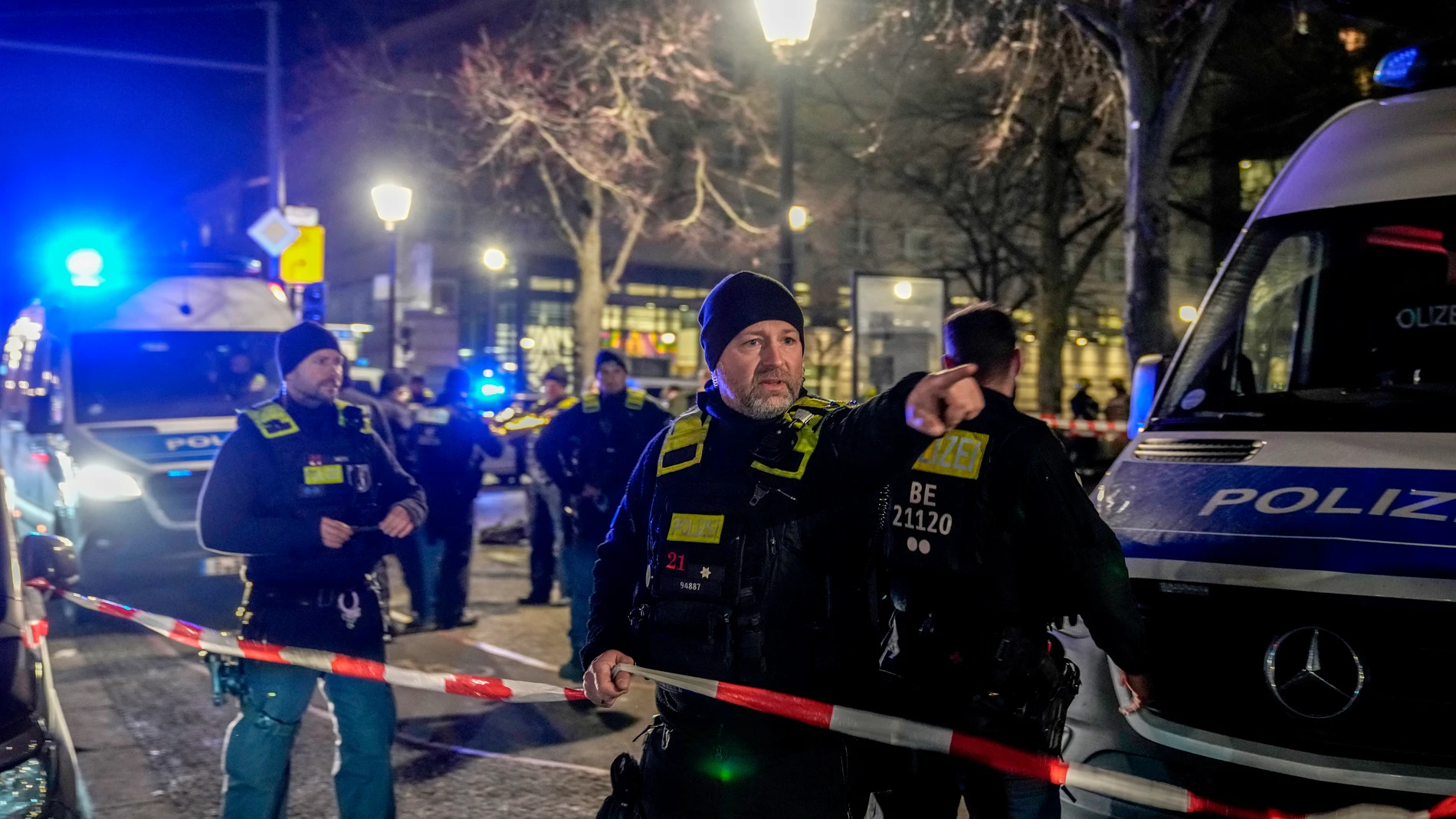 Police officers attend the scene at the Holocaust memorial after a man was attacked at the memorial site in Berlin, Germany, Friday, Feb. 21, 2025. (AP Photo/Ebrahim Noroozi)