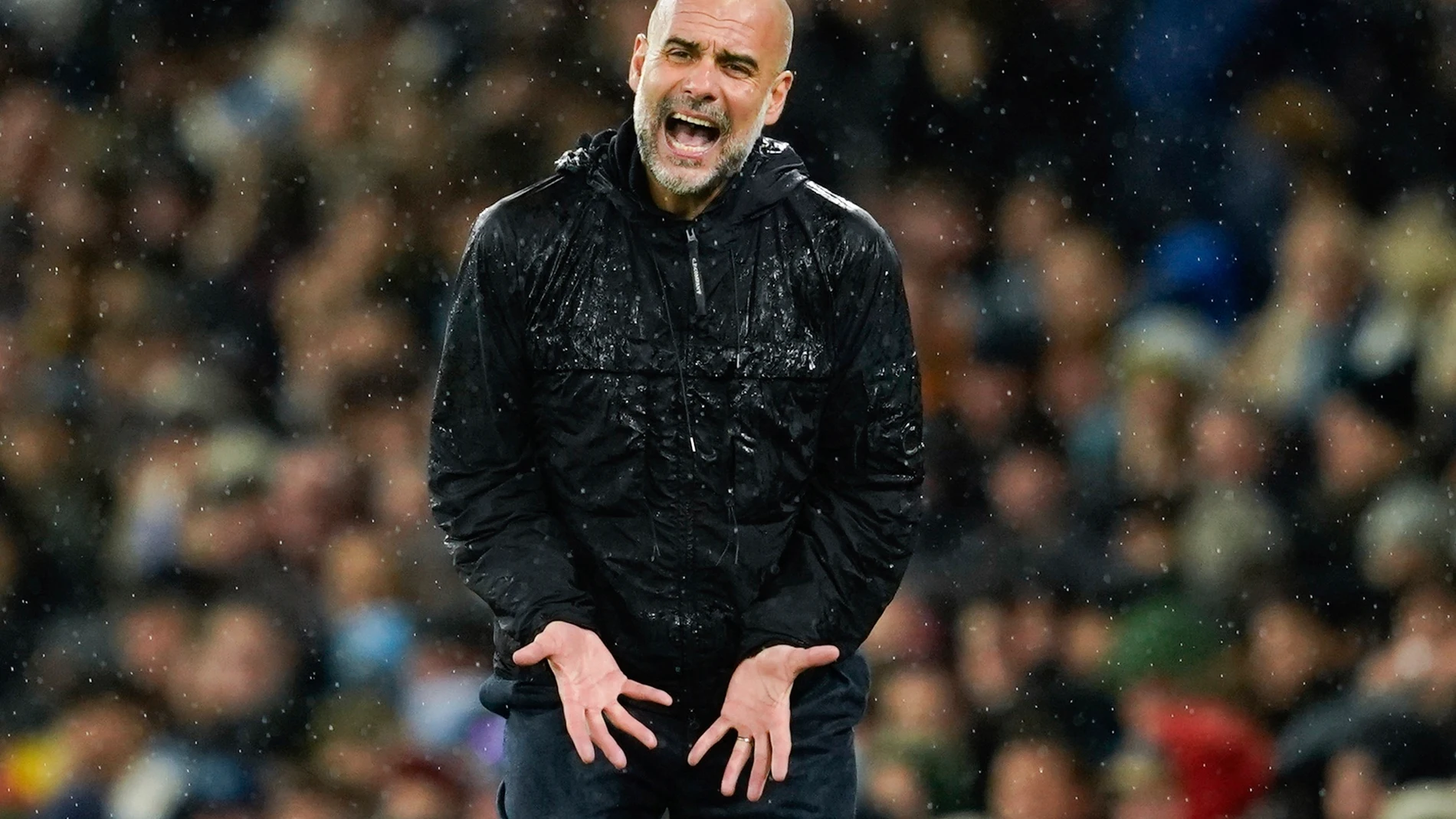 Manchester City's head coach Pep Guardiola reacts during the English Premier League soccer match between Manchester City and Liverpool at Etihad stadium in Manchester, England, Sunday, Feb. 23, 2025. (AP Photo/Dave Thompson)