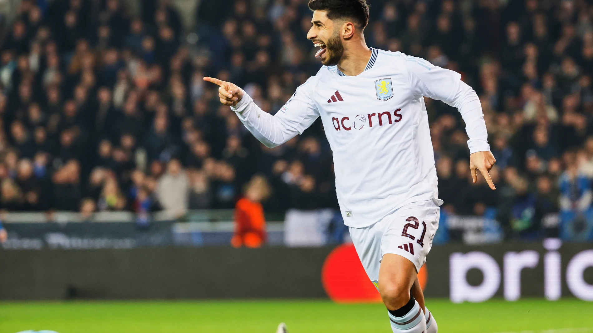 Aston Villa's Marco Asensio celebrates after an own goal by Brugge's Brandon Mechele made it past Brugge's goalkeeper Simon Mignolet during the Champions League round of 16 first leg soccer match between Club Brugge and Aston Villa at the Jan Breydel Stadium in Bruges, Belgium, Tuesday, March 4, 2025. (AP Photo/Geert Vanden Wijngaert)