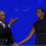 Former President Barack Obama hugs former first lady Michelle Obama as he is introduced during the Democratic National Convention Tuesday, Aug. 20, 2024, in Chicago. 