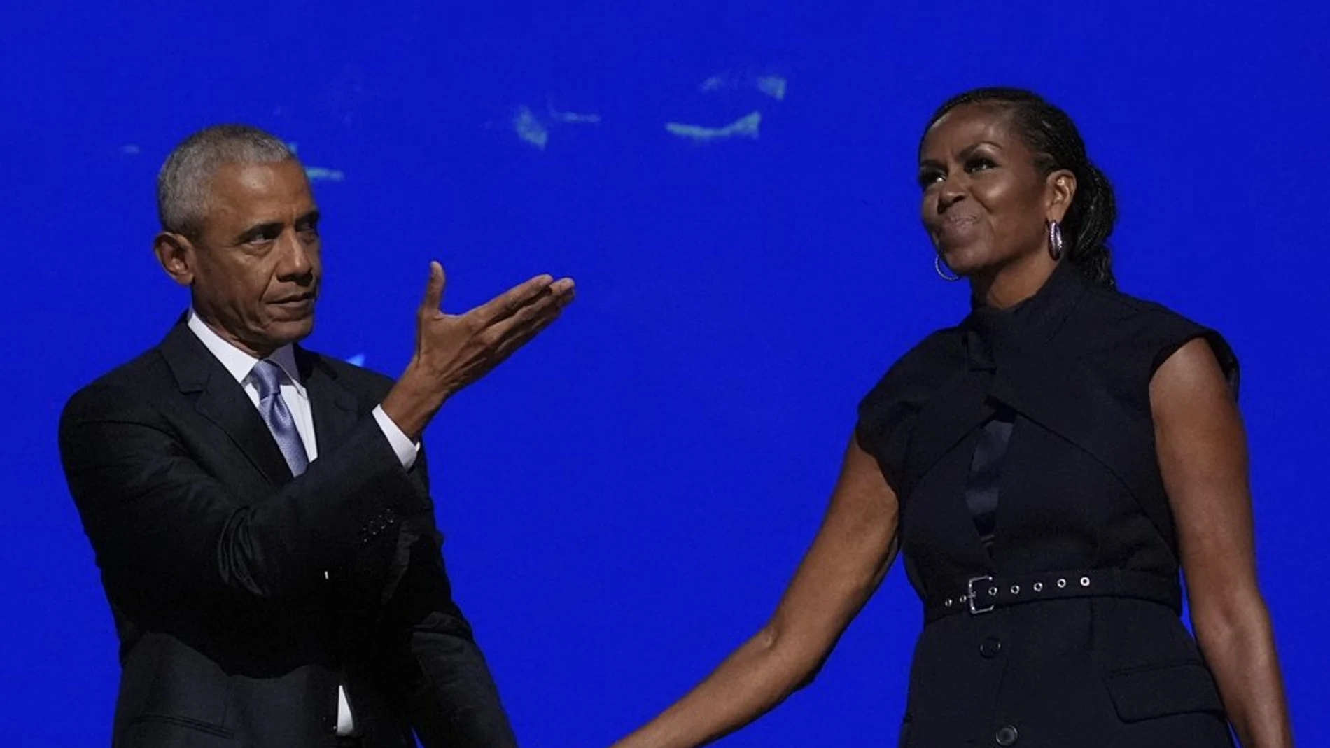 Former President Barack Obama hugs former first lady Michelle Obama as he is introduced during the Democratic National Convention Tuesday, Aug. 20, 2024, in Chicago.