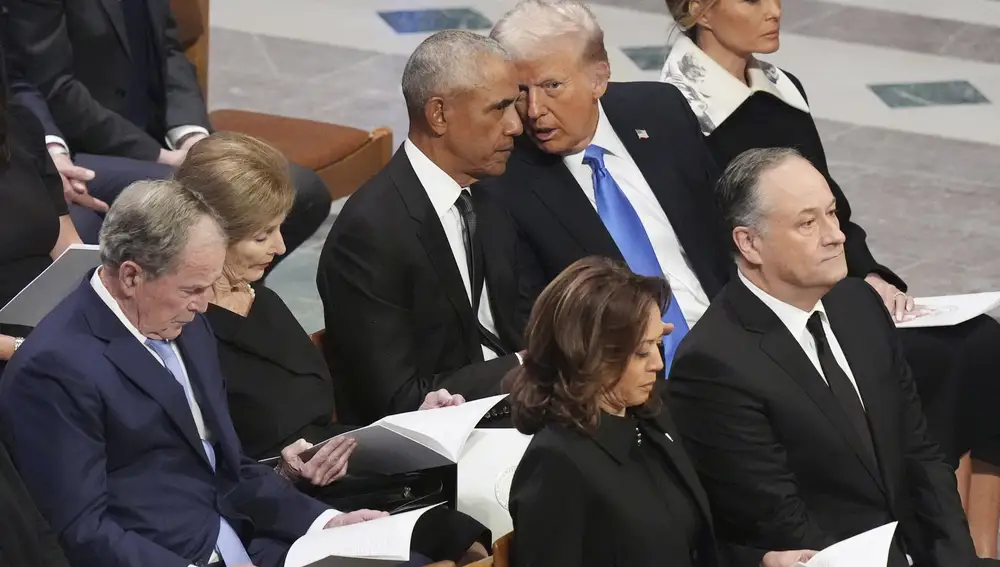 Former President Barack Obama talks with President-elect Donald Trump as Melania Trump listens and as former President Geroge W. Bush, Laura Bush, Vice President Kamala Harris, and second gentleman Doug Emhoff arrive, before the state funeral for former President Jimmy Carter at Washington National Cathedral in Washington, Thursday, Jan. 9, 2025.