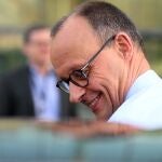 The leader of Germany's Christian Democratic Union (CDU) party Friedrich Merz gets into a car as he leaves after giving a statement in Berlin on March 8, 2025, as exploratory talks were held between the conservative CDU/CSU union and the social democratic SPD party on forming a future government coalition following Germany's February 23 general election. 
