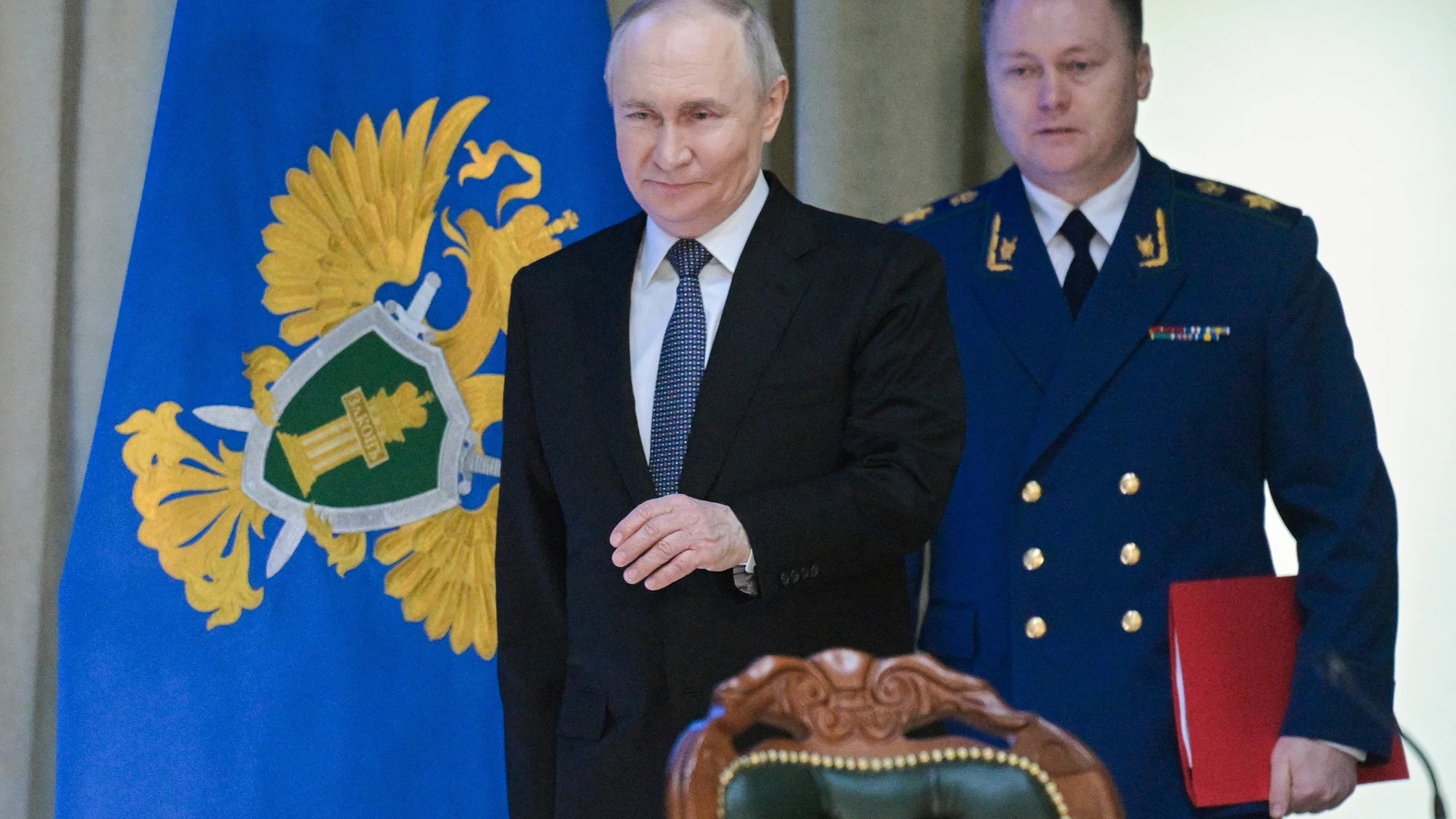 Russian President Vladimir Putin, center, and Russian Prosecutor General Igor Krasnov arrive to attend a meeting of the Prosecutor General's Office Board in Moscow, Russia, Wednesday, March 19, 2025. (Alexei Nikolsky, Sputnik, Kremlin Pool Photo via AP)