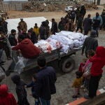 Palestinians mourn their dead following fresh Israeli airstrikes on northern Gaza