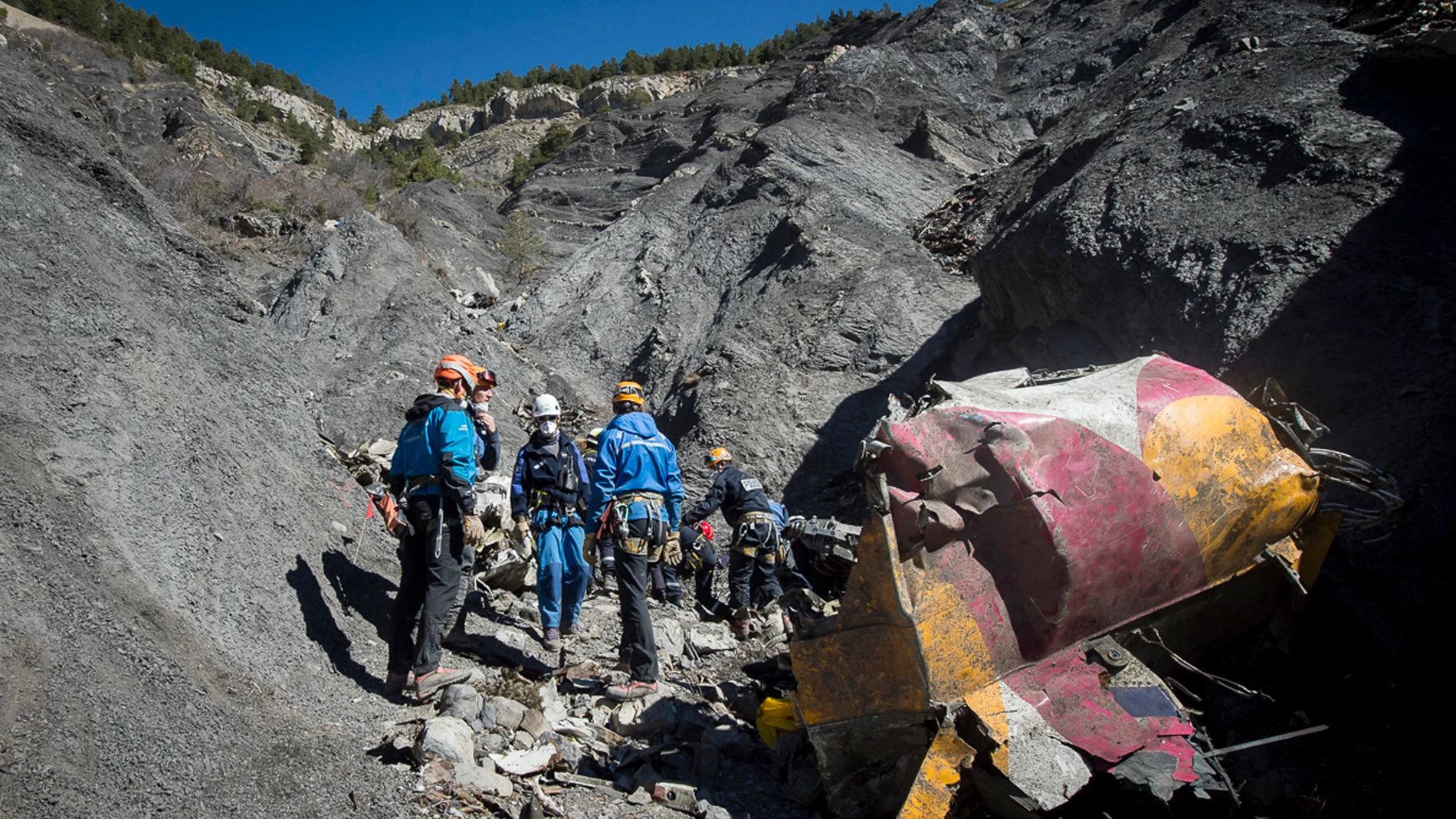 FILE - This photo provided by the French Interior Ministry shows French emergency rescue services work among the debris of the Germanwings passenger jet at the crash site near Seyne-les-Alpes, France, March 31, 2015. (Yves Malenfer/Ministere de l'Interieur via AP, File)