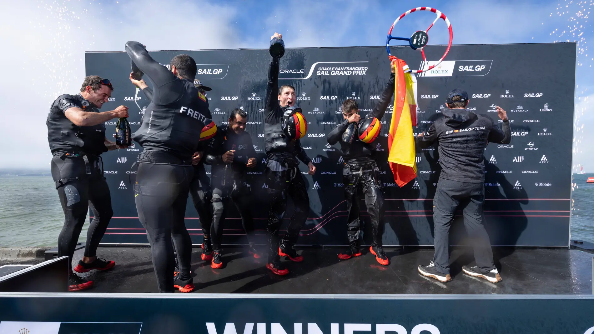 Spain SailGP Team helmed by Diego Botin celebrate on stage after winning the Oracle San Francisco Sail Grand Prix in San Francisco, Sunday, March 23, 2025. (Jed Jacobsohn/SailGP via AP)
