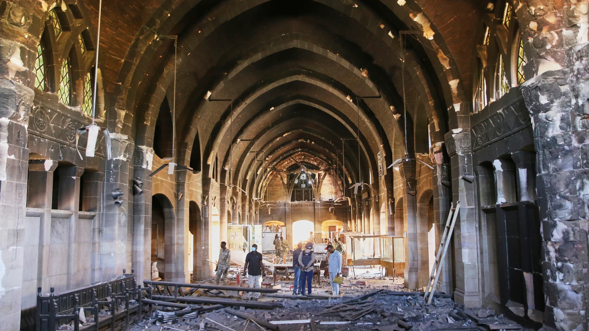 Local journalists inspect a destroyed hall of the Republican Palace after it was recaptured by Sudan's army from the Rapid Support Forces paramilitary group, Monday, March 24, 2025, in Khartoum, Sudan. (AP Photo)