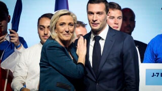 FILE - Leader of the French far-right National Rally Marine Le Pen, left, and Jordan Bardella, lead candidate of the party for the upcoming European election, right, are seen during a political meeting on June 2, 2024, in Paris. (AP Photo/Thomas Padilla, File)