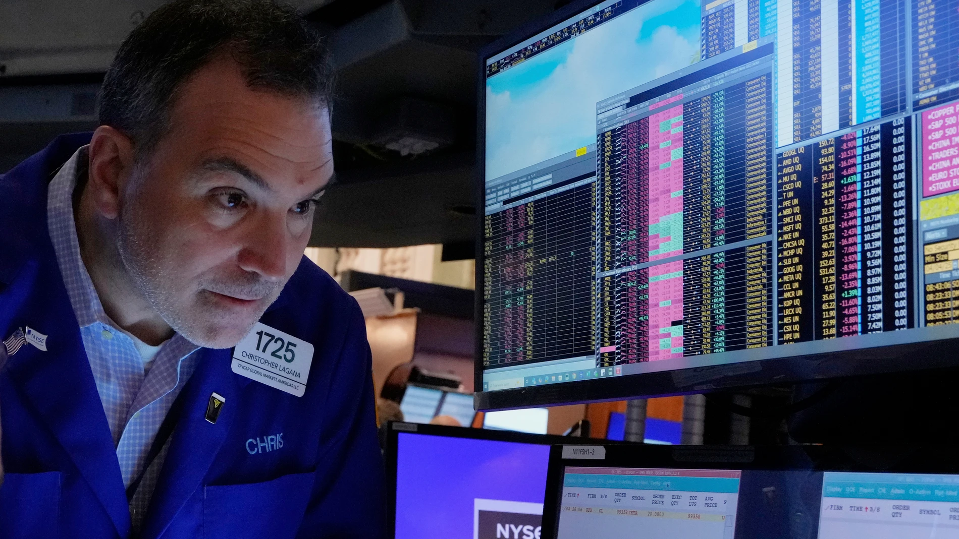 Trader Christopher Lagana works on the floor of the New York Stock Exchange, Friday, April 4, 2025. (AP Photo/Richard Drew)