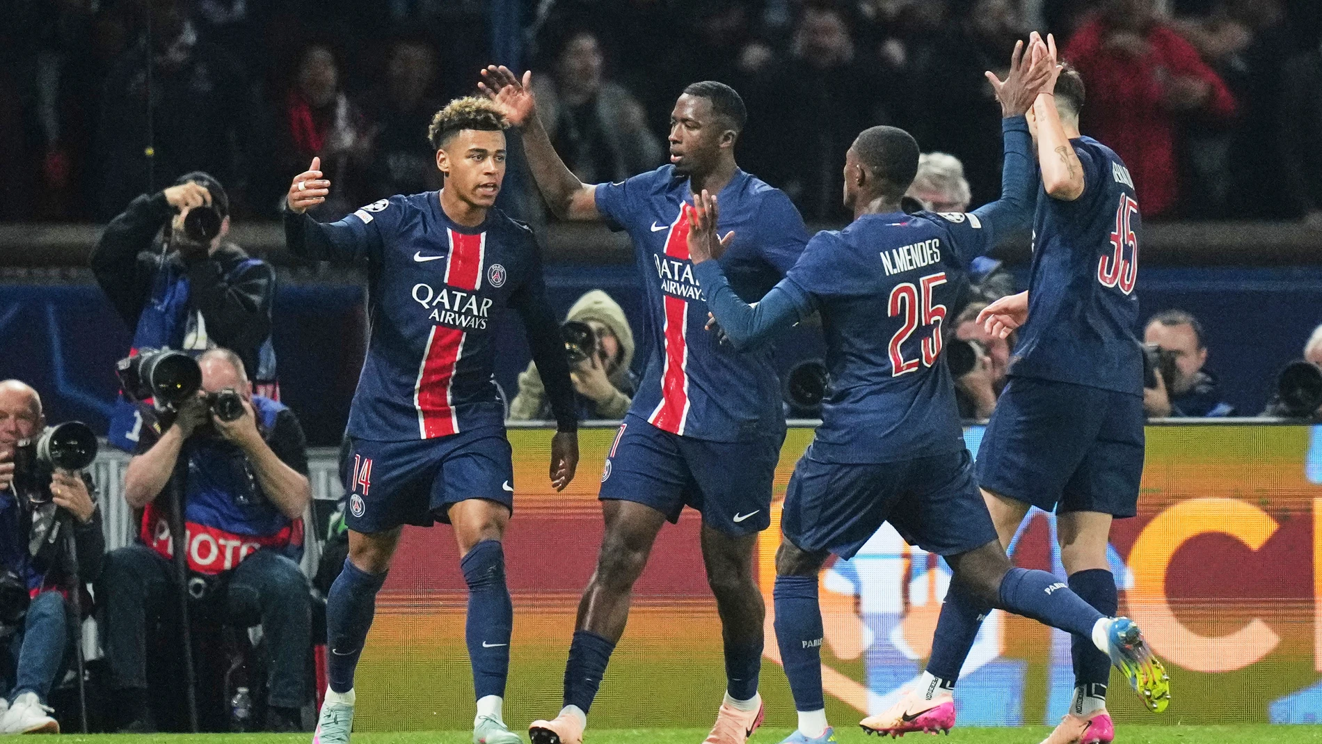 PSG's Desire Doue, left, celebrates after scoring his side's first goal during the Champions League quarterfinal first leg soccer match between Paris Saint-Germain and Aston Villa at Parc des Princes stadium in Paris, Wednesday, April 9, 2025. (AP Photo/Thibault Camus)