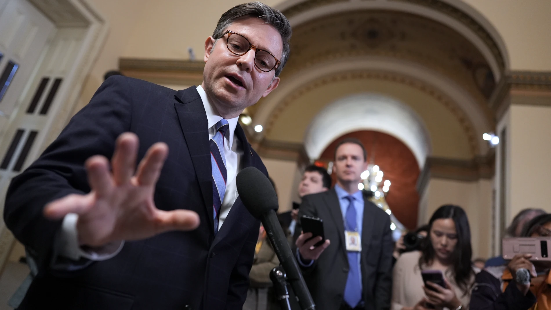 Speaker of the House Mike Johnson, R-La., talks to reporters just after House Republicans narrowly approved their budget framework, at the Capitol in Washington, Thursday, April 10, 2025. (AP Photo/J. Scott Applewhite)