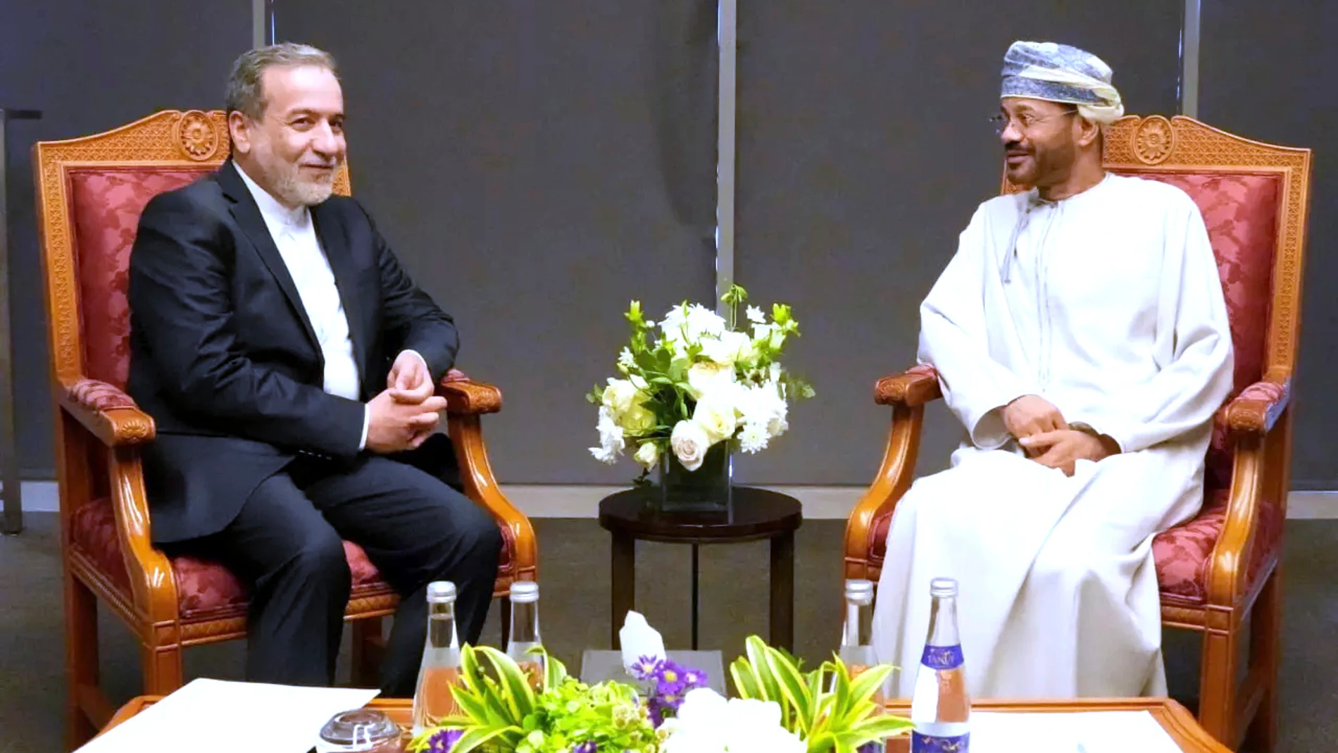 In this photo released by Iranian Foreign Ministry, Iranian Foreign Minister Abbas Araghchi, left, meets his Omani counterpart Sayyid Badr Albusaidi prior to negotiations with U.S. Mideast envoy Steve Witkoff in Muscat, Oman, Saturday, April 12, 2025. (Iranian Foreign Ministry via AP)