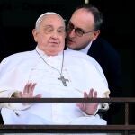 Pope Francis (L) greets and blesses the faithful from the balcony of the Gemelli hospital where has been hospitalized, in Rome, Italy, 23 March 2025.. Massimiliano Strappetti