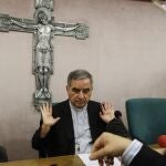 FILE - Cardinal Angelo Becciu talks to journalists during press conference in Rome on Sept. 25, 2020. Lawyers for the once-powerful cardinal have accused Vatican prosecutors of being "prisoners to their completely shattered theory" in closing arguments of a two-year trial. Becciu is on trial along with nine other people in a case that is focused on the Vatican's 350 million-euro investment in a London property. (AP Photo/Gregorio Borgia, File)