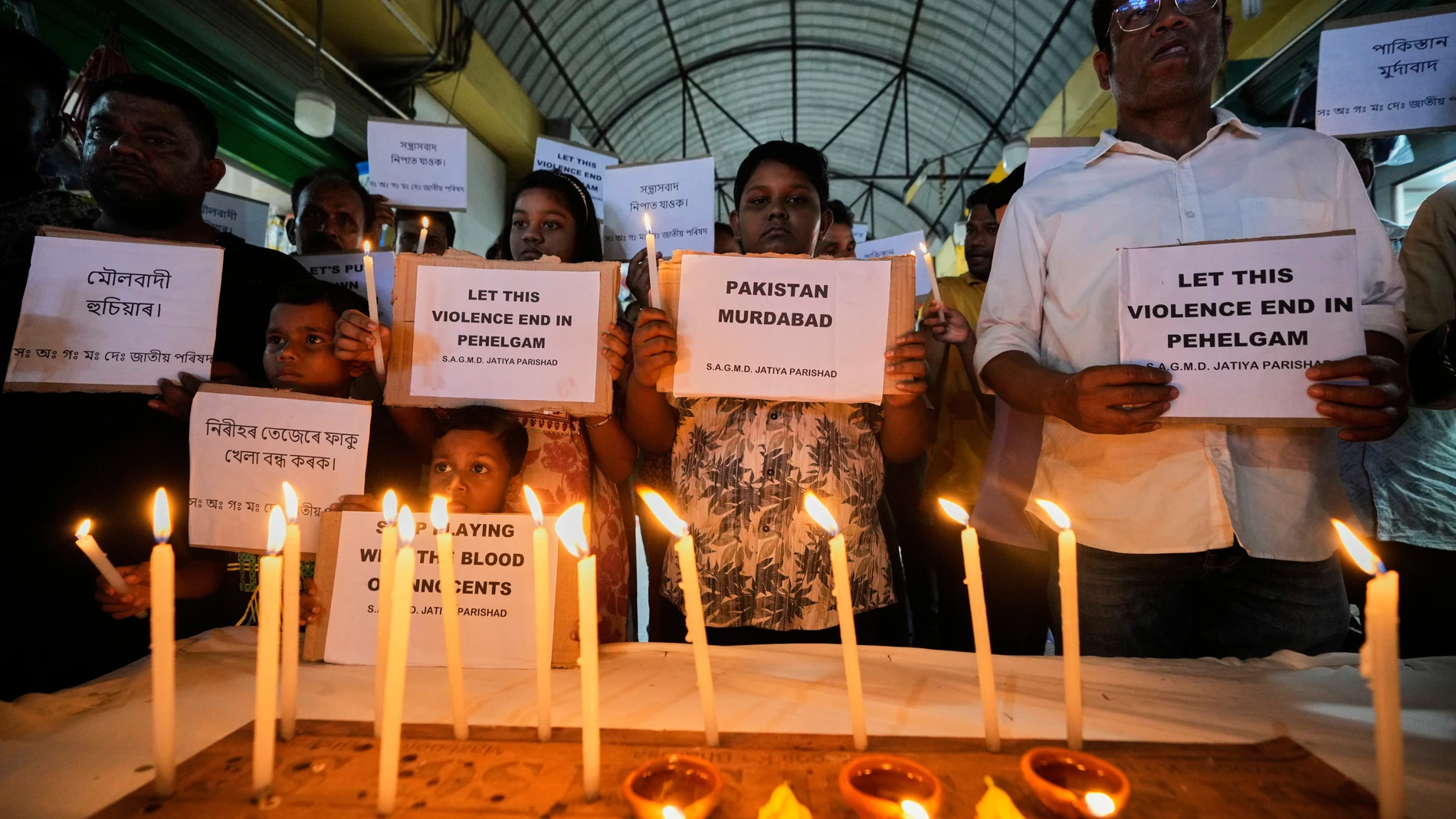 People protest against the killing of tourists by militants a day after militants indiscriminately opened fire on tourists near Pahalgam in Indian controlled Kashmir, in Guwahati, India, Wednesday, April 23, 2025. (AP Photo/Anupam Nath)