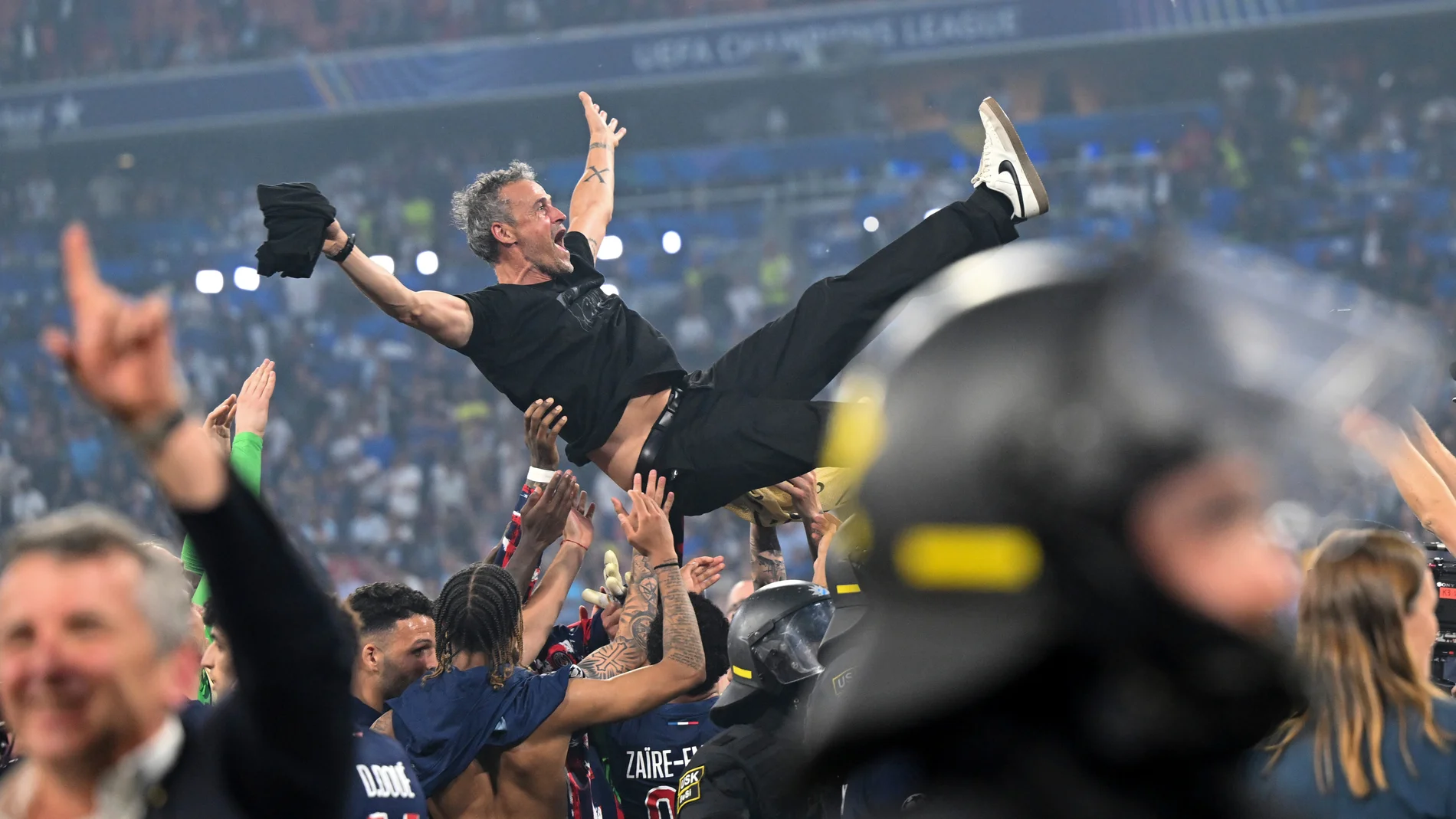 PSG's coach Luis Enrique is thrown into the air by his players as they celebrate winning the Champions League final soccer match between Paris Saint Germain and Inter Milan, at the Allianz Arena in Munich, Germany, Saturday, May 31, 2025. (Sven Hoppe/dpa via AP)