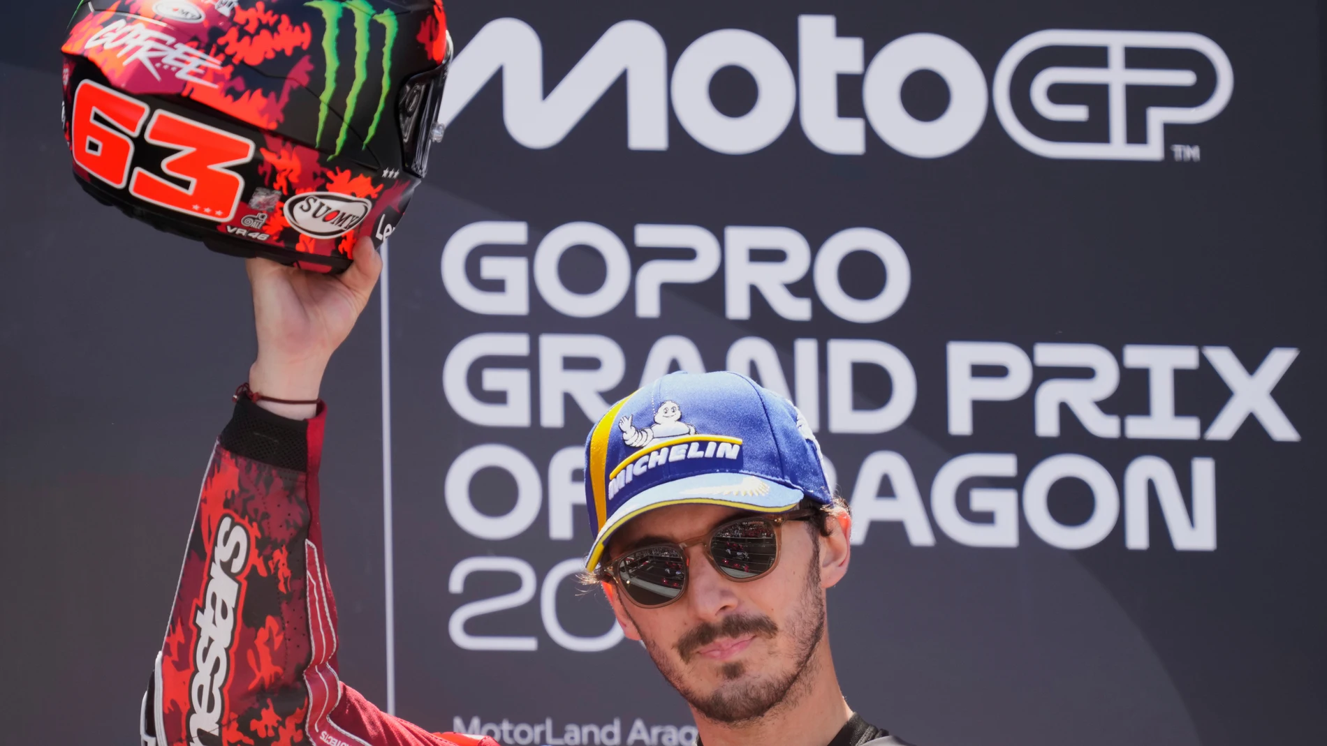 Third placed Italian rider Francesco Bagnaia of the Ducati Lenovo Team celebrates on the podium after the MotoGP race of the Grand Prix of Aragon at the MotorLand Aragon circuit, in Alcaniz, Spain, Sunday, June 8, 2025. (AP Photo/Jose Breton)