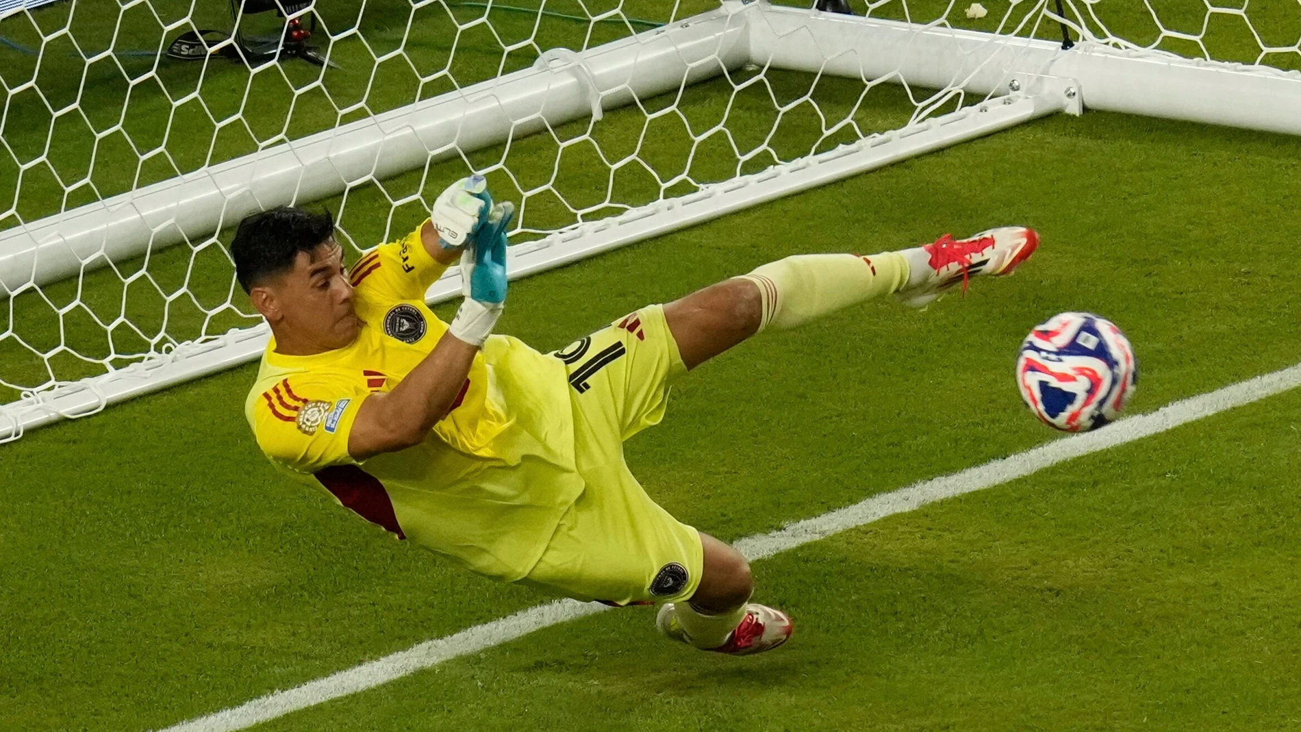 Inter Miami's Oscar Ustari saves a penalty from Al Ahly's Trezeguet during the Club World Cup group A soccer match between Al Ahly and Inter Miami in Miami, Fla., Saturday, June 14, 2025. (AP Photo/John Raoux)
