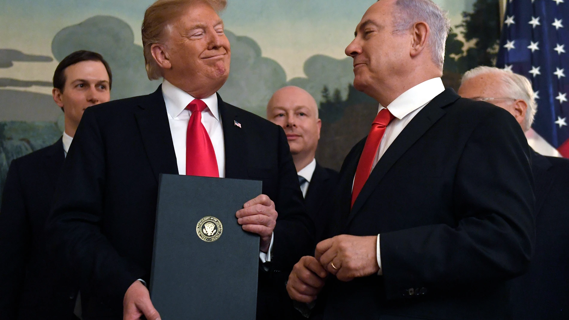 FILE - In this March 25, 2019 file photo, President Donald Trump smiles at Israeli Prime Minister Benjamin Netanyahu, right, after signing a proclamation at the White House in Washington. (AP Photo/Susan Walsh, File)