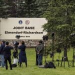 Members of the media stand outside Joint Base Elmendorf-Richardson in Anchorage, Alaska, Thursday, Aug. 14, 2025, ahead of a meeting between President Donald Trump and Russia's President Vladimir Putin. 