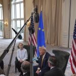 Journalists hold their microphones as President Donald Trump meets European Commission President Ursula von der Leyen at the Trump Turnberry golf course in Turnberry, Scotland Sunday, July 27, 2025. 