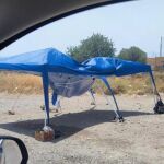 Carpa bajo la que trabajan los agentes