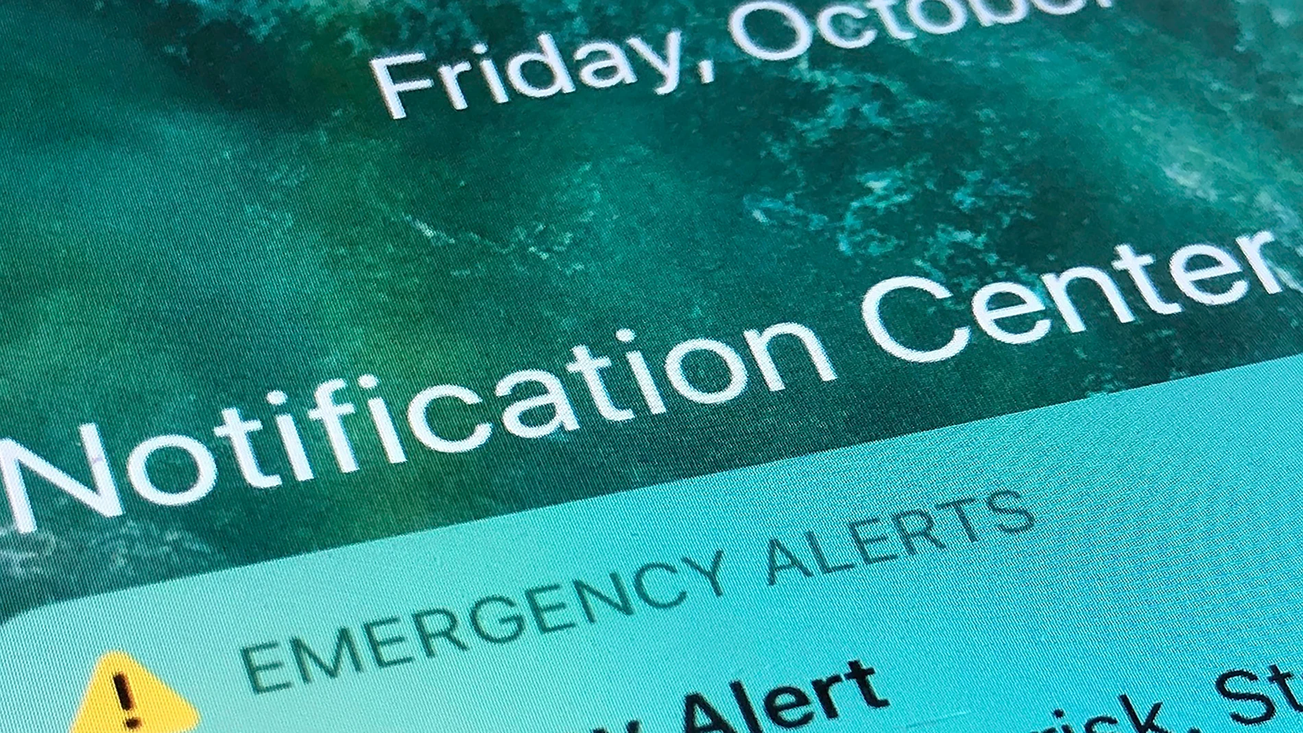 FILE - An emergency alert is displayed on a cellphone, Oct. 30, 2020, in Rio Rancho, N.M. (AP Photo/Susan Montoya Bryan, File)