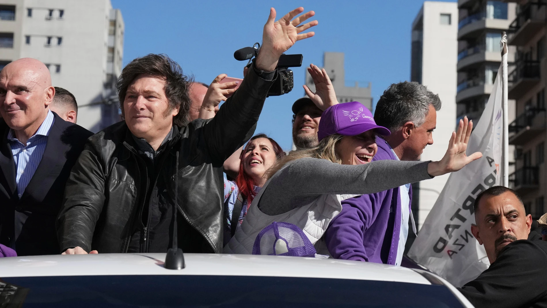 Argentine President Javier Milei and his sister, Secretary General of the Presidency, Karina Milei attend a campaign rally ahead of legislative provincial elections in Lomas de Zamora, Argentina, Wednesday, Aug. 27, 2025. (AP Photo/Natacha Pisarenko)