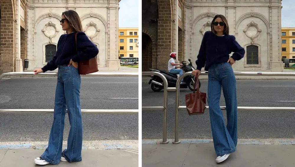 Vaqueros de corte ancho con jersey azul marino y bolso clásico marrón, un look sencillo construido solo con básicos del armario cápsula.