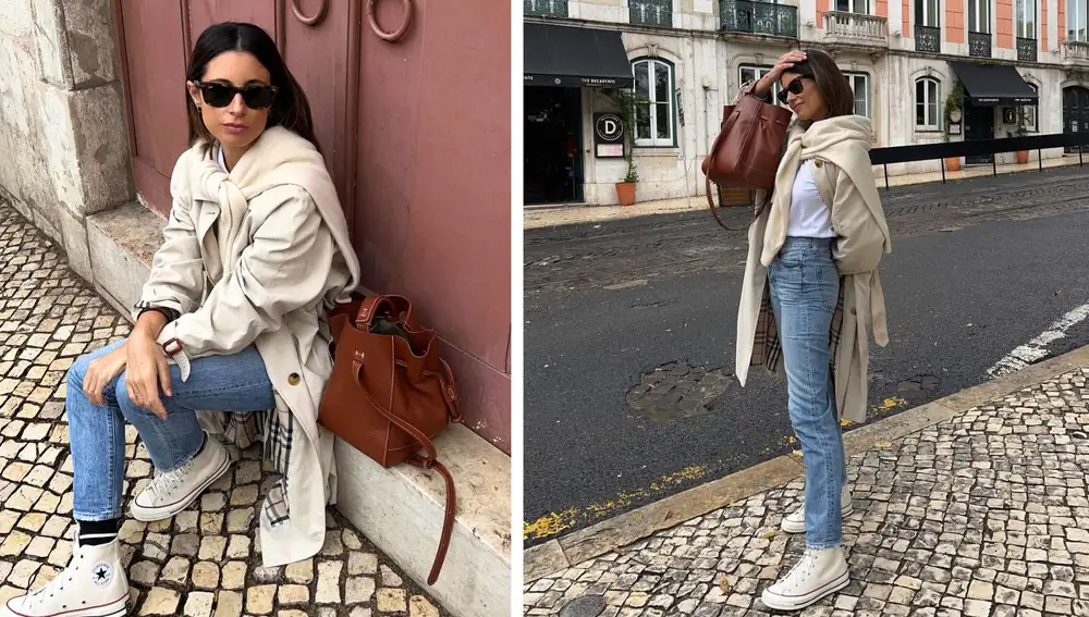Gabardina larga en tono neutro combinada con vaqueros rectos, camiseta blanca y bolso de piel en color marrón. Un look cápsula de otoño fácil de replicar.