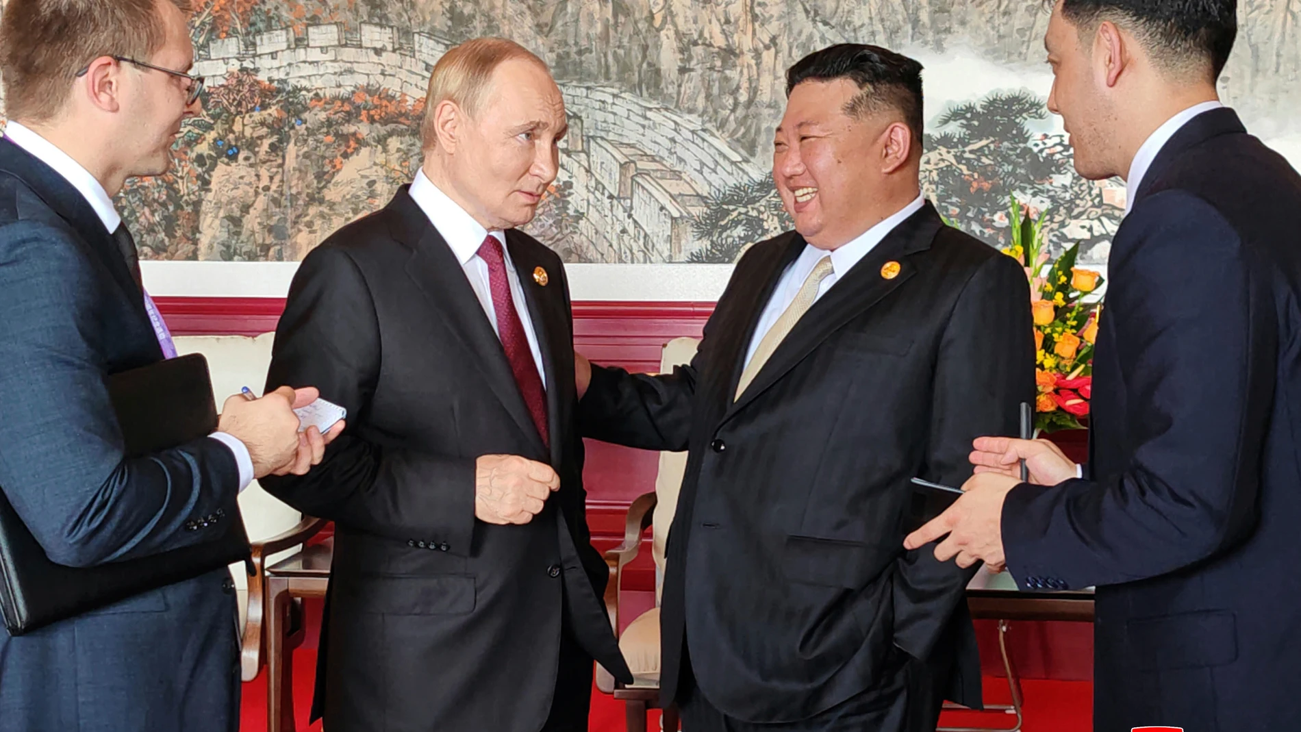 In this photo provided by the North Korean government, North Korean leader Kim Jong Un, center right, and Russian President Vladimir Putin, center left, talk in Beijing Wednesday, Sept. 3, 2025. Independent journalists were not given access to cover the event depicted in this image distributed by the North Korean government. The content of this image is as provided and cannot be independently verified. Korean language watermark on image as provided by source reads: "KCNA" which is the abbrevi...