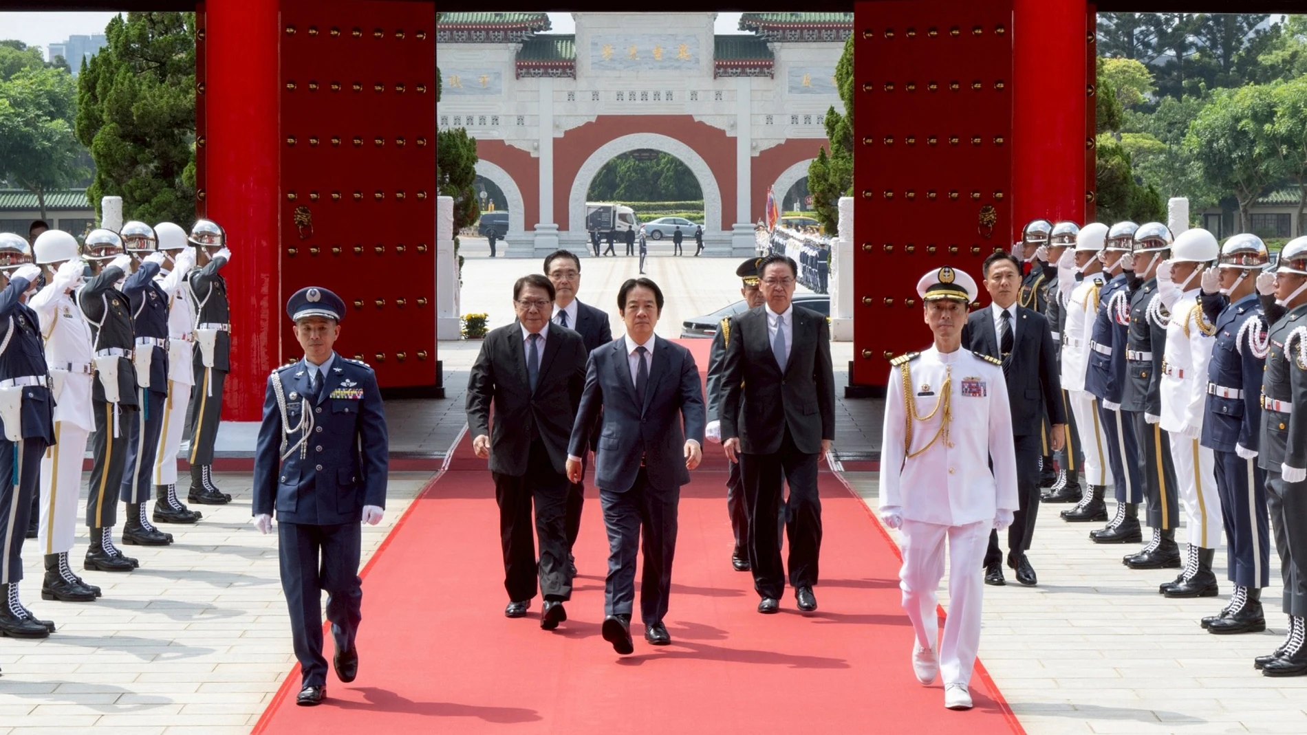 In this photo released by the Taiwan Presidential Office, Taiwan's President Lai Ching-te, center, arrives for a ceremony for honoring soldiers and officials during Taiwan's Arm Forces Day on Wednesday, Sep. 3, 2025 in Taipei, Taiwan. (Taiwan Presidential Office via AP)