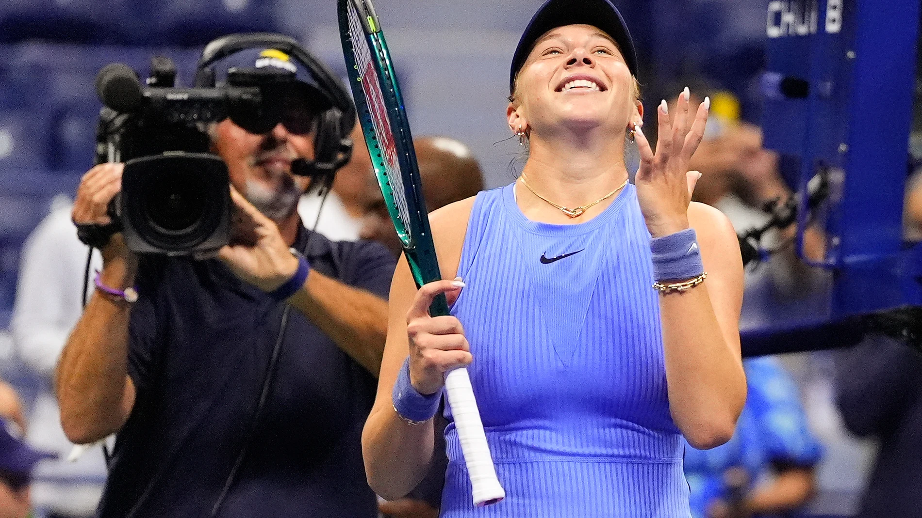 Amanda Anisimova, of the United States, reacts after defeating Naomi Osaka, of Japan, during the women's singles semifinals of the U.S. Open tennis championships, Friday, Sept. 5, 2025, in New York. (AP Photo/Yuki Iwamura)
