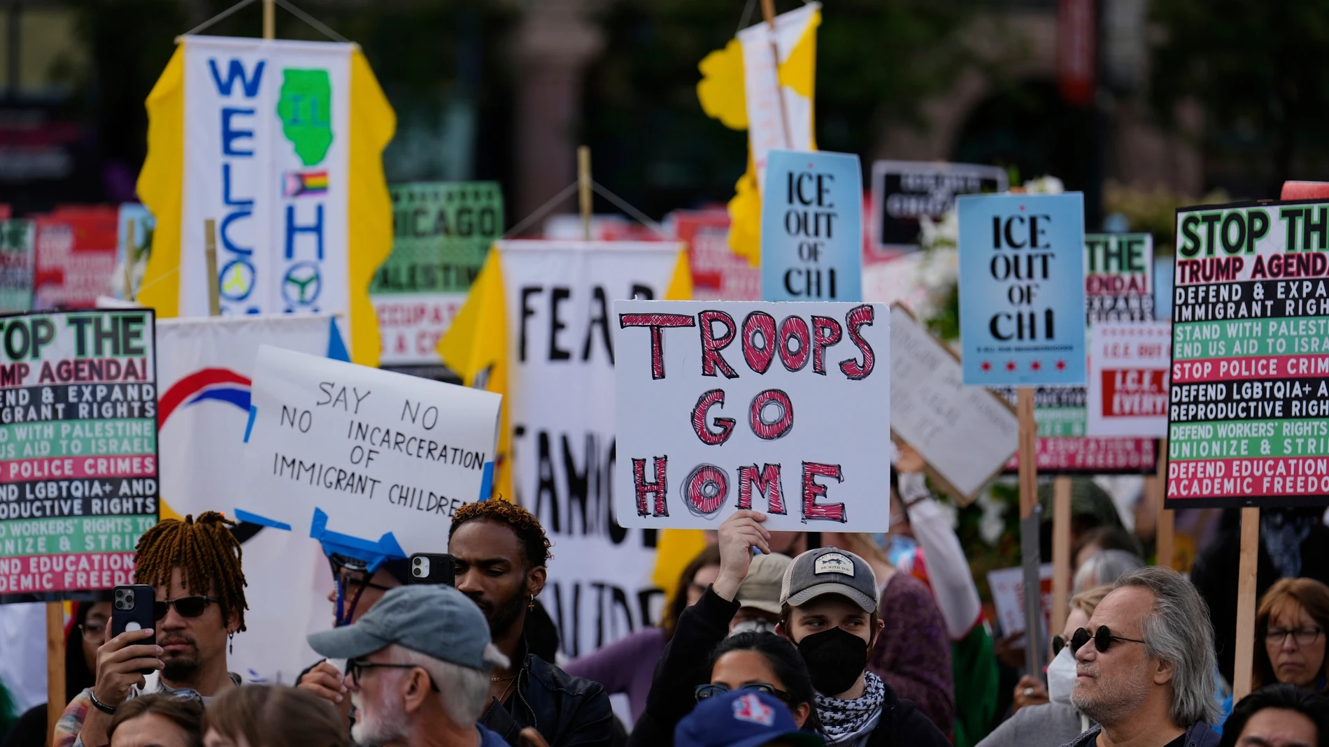 People gather during Illinois Coalition for Immigrant & Refugee Rights' "Chicago Says No Trump No Troops" protest Saturday, Sept. 6, 2025, in Chicago. (AP Photo/Carolyn Kaster)