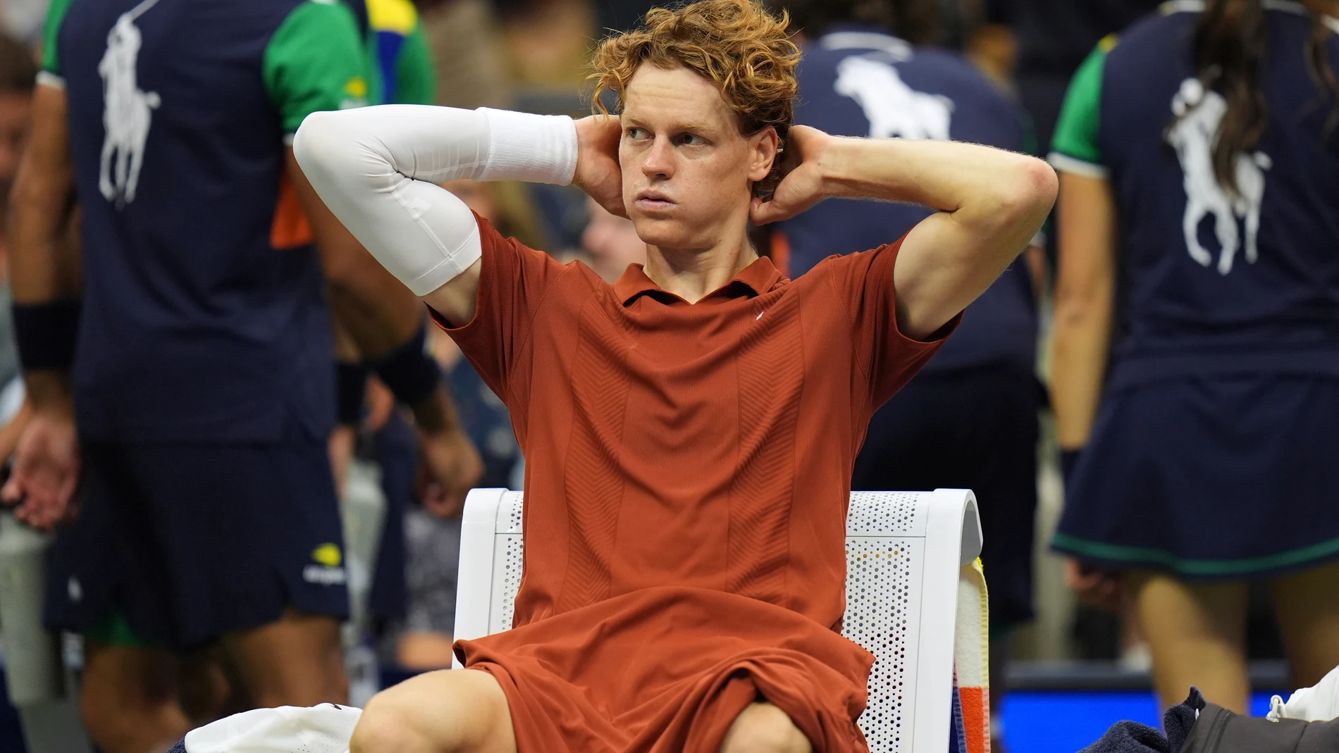 Jannik Sinner, of Italy, sits between sets during the men's singles final of the U.S. Open tennis championships against Carlos Alcaraz, of Spain, Sunday, Sept. 7, 2025, in New York. (AP Photo/Seth Wenig)