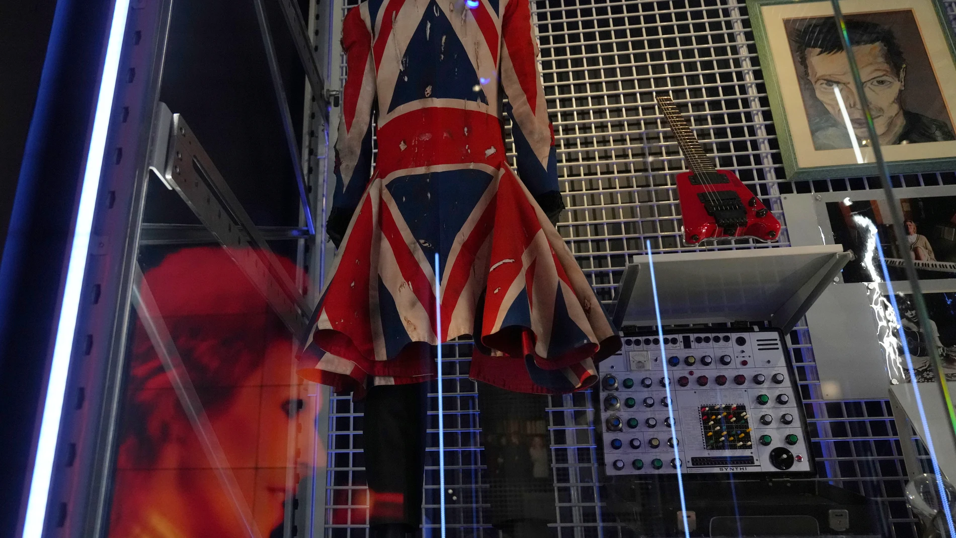 Earthling, a Union Flag frock coat designed by David Bowie and Alexander McQueen in 1997, is on display during a press preview of the David Bowie Centre, a new archive at the V&A East Storehouse in London, Wednesday, Sept. 10, 2025, ahead of its public opening on Saturday. (AP Photo/Joanna Chan)