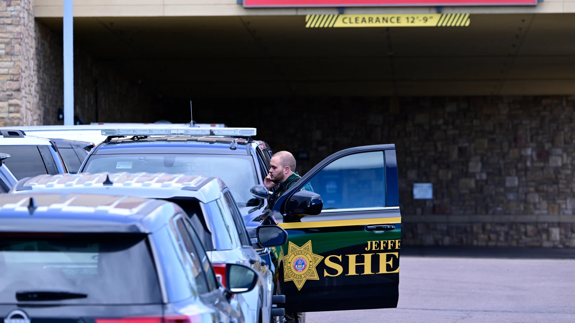 A Jefferson County, Colo., Sheriffs Department deputy is stationed outside of the St. Anthony's Hospital emergency entrance in Lakewood, Colo., on Wednesday, Sept. 10, 2025. (Andy Cross/The Denver Post via AP)